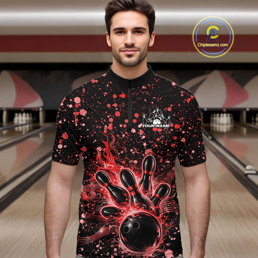 Male model wearing a black bowling quarter-zip shirt at the bowling lane with red splatter details and bowling strike graphics.