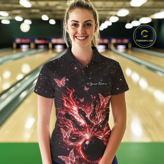 Female model wearing a black and red bowling polo shirt at the lane with cosmic bowling strike artwork.