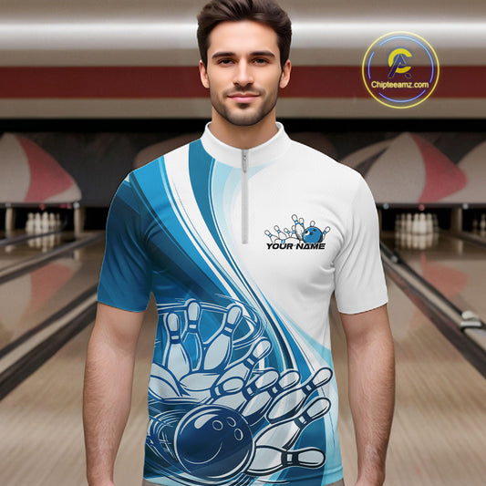 Male model in a bowling alley wearing a white and blue quarter zip shirt, showing a sweeping curve bowling ball striking pins design.