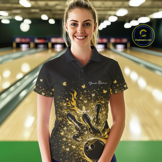 Female model in a black and yellow bowling polo shirt at the lane with fiery bowling strike graphics.