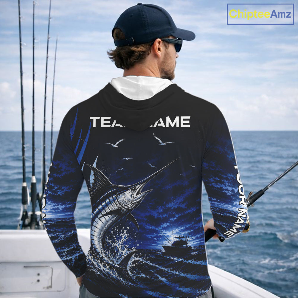 Angler wearing personalized Blue Marlin blue long sleeve hooded performance fishing shirt on the water