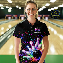 Load image into Gallery viewer, Woman wearing a colorful bowling-themed shirt with a bowling alley in the background
