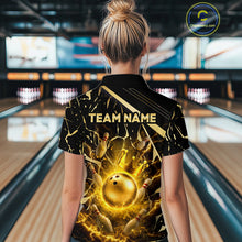 Load image into Gallery viewer, Female model wearing a custom black gold bowling polo shirt back view displaying the personalized team name above a glowing bowling ball with lightning energy artwork at the bowling alley