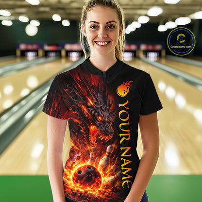 Person wearing a black bowling shirt with a dragon design and 'Your Name' text in a bowling alley.
