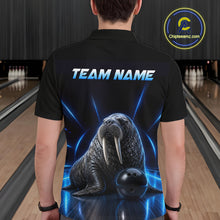 Load image into Gallery viewer, Person wearing a black t-shirt with a walrus graphic and 'TEAM NAME' text in a bowling alley.