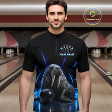 Load image into Gallery viewer, Man wearing a black bowling shirt with a walrus design in a bowling alley.