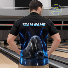 Load image into Gallery viewer, Person wearing a black bowling shirt with a walrus design and 'TEAM NAME' text on the back, standing in a bowling alley.
