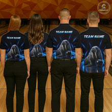 Load image into Gallery viewer, Four people wearing black shirts with a team name and graphic of a walrus on a bowling alley.
