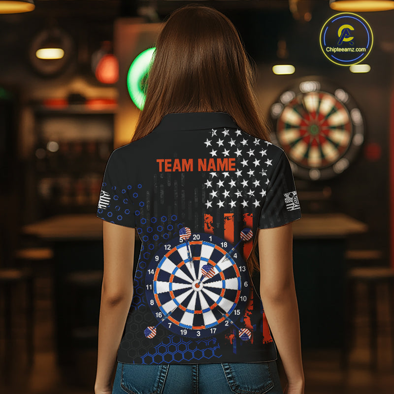 Back view of a female model wearing a custom black darts polo shirt featuring an American flag design, a large dartboard graphic, and 'TEAM NAME' printed in orange
