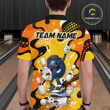 Load image into Gallery viewer, Person wearing a colorful bowling-themed shirt with cartoon characters in a bowling alley.