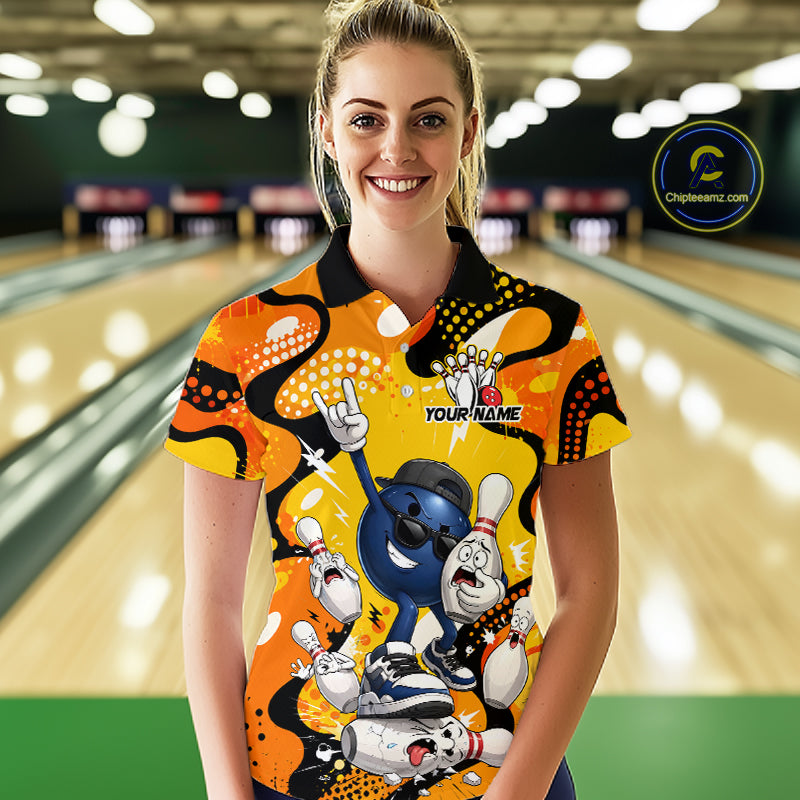 Woman wearing a colorful bowling shirt with cartoon characters in a bowling alley.