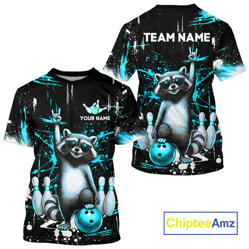 Black and turquoise t-shirt with raccoon design and customizable text, featuring the brand 'ChipteeAmz'.