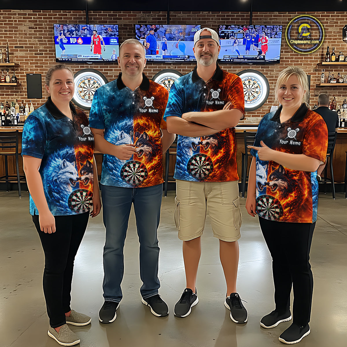 Group of four wearing matching custom fire and ice wolf dart polo shirts featuring fierce wolves, flaming dartboards, and blue icy flames in a professional dart room.