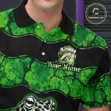 Load image into Gallery viewer, A close-up of a custom green and black frog-themed polo shirt worn by a model. The shirt features a green and black mottled pattern, a black collar, and custom graphic prints including a frog mascot, the text 'Your Name', and a large frog head at the bottom.