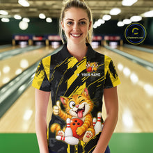 Load image into Gallery viewer, Female model wearing a custom black yellow cat bowling polo shirt front view featuring a playful cartoon cat, bowling ball, bowling pins and yellow black paint stroke pattern at the bowling alley