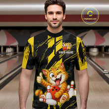 Load image into Gallery viewer, Male model wearing a custom black yellow cat bowling quarter-zip shirt front view featuring a playful cartoon cat, bowling ball, bowling pins and yellow black paint stroke pattern at the bowling alley