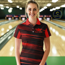 Load image into Gallery viewer, Female model wearing a custom black red bowling polo shirt front view featuring a red bowling ball emblem, dynamic red brush stroke pattern and striped design at the bowling alley