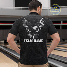 Load image into Gallery viewer, Male model wearing a custom black patriotic bowling quarter-zip shirt back view displaying the personalized team name below a spread-wing bald eagle graphic at the bowling alley