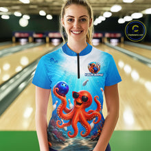 Load image into Gallery viewer, Person wearing a blue bowling shirt with an octopus design in a bowling alley.