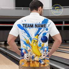 Load image into Gallery viewer, Person wearing a white shirt with a colorful design of a banana character and bowling elements, with 'TEAM NAME' text on the back, in a bowling alley.