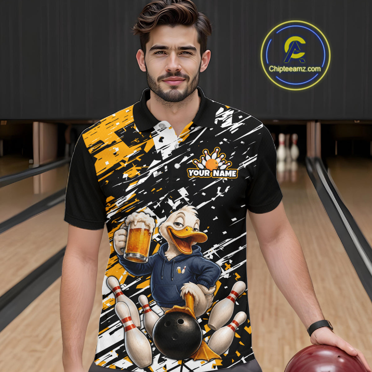 A man wearing a custom bowling polo shirt with a cartoon duck character holding a beer and bowling pins, set against a bowling alley background. The shirt features a black base with yellow and white paint splatter graphics and a customizable name patch.