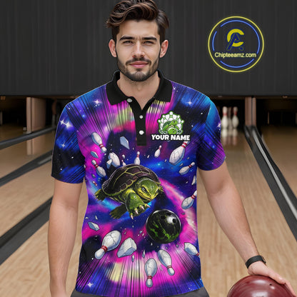 Man wearing a colorful bowling shirt with a turtle design in a bowling alley.