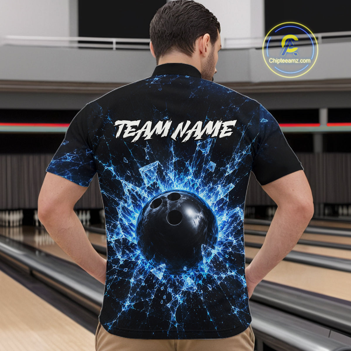 Person wearing a black bowling shirt with a blue and white design and 'TEAM NAME' text, standing in a bowling alley.