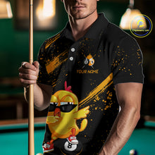 Load image into Gallery viewer, Person wearing a black polo shirt with a yellow duck graphic and pool cue in a billiards setting