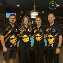 Load image into Gallery viewer, Four people wearing matching polo shirts with a cartoon chicken design in a bar setting.