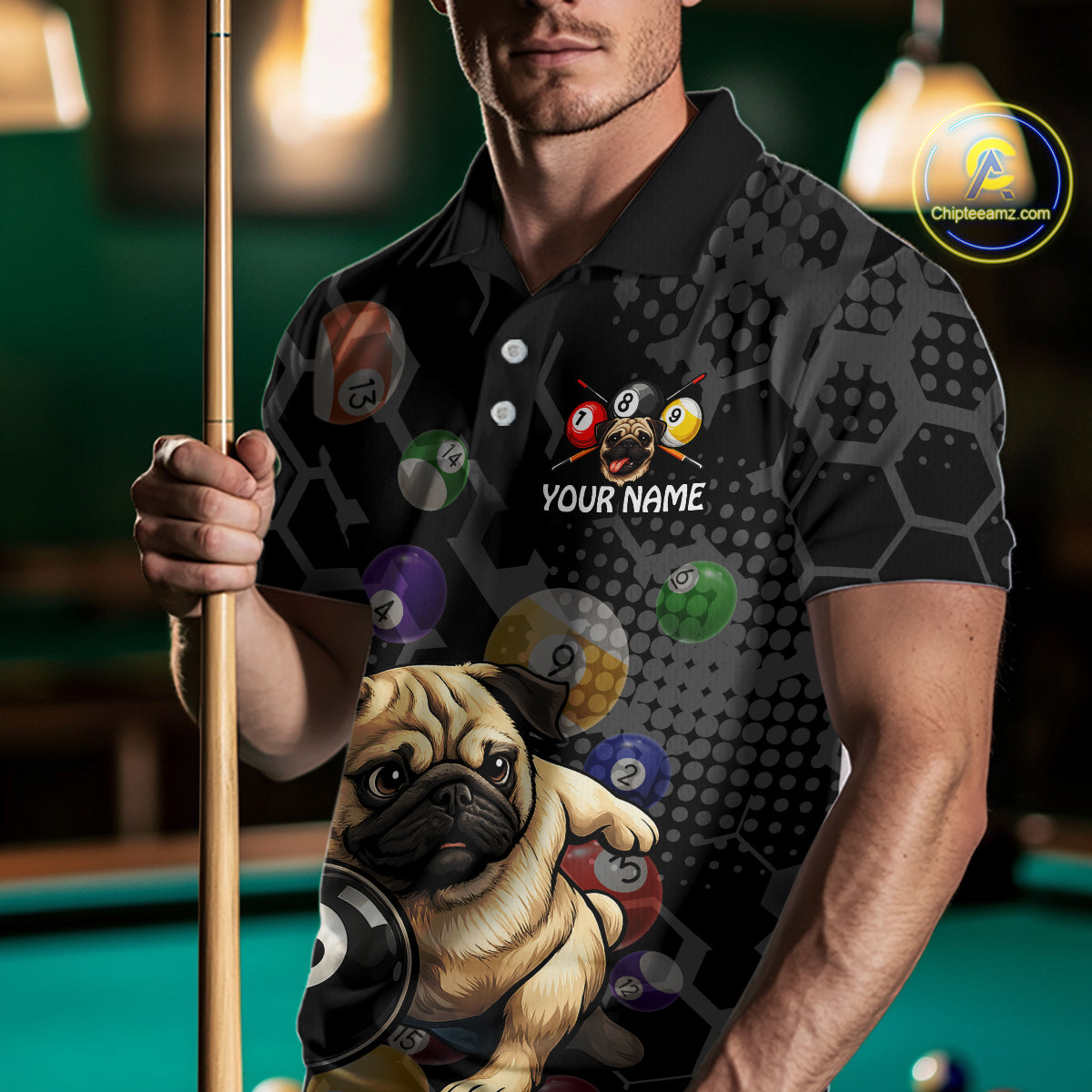 Man holding a pool cue wearing a shirt with a pug and pool ball design.