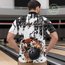 Load image into Gallery viewer, Person wearing a bowling-themed shirt with a dog holding a bowling ball design in a bowling alley.