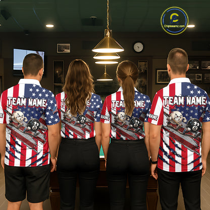 Four people standing with their backs to the camera in a dimly lit indoor room, wearing matching patriotic American flag-themed jerseys with 'TEAM NAME' printed across the back. The jerseys feature red and white stripes, white stars on a blue field, and a graphic of pool balls and a cue stick.
