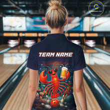 Load image into Gallery viewer, Person wearing a t-shirt with a lobster graphic and 'Team Name' text in a bowling alley.