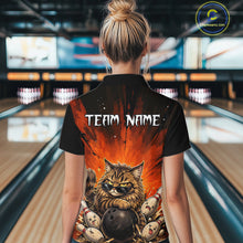 Load image into Gallery viewer, Person wearing a black shirt with a graphic design of a cat and bowling balls in a bowling alley.