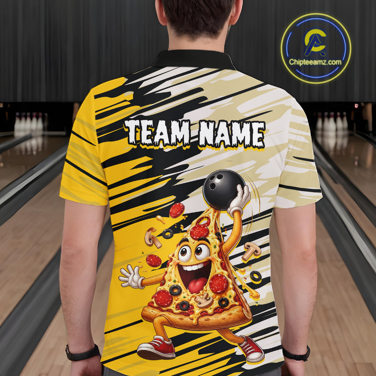 Person wearing a bowling-themed shirt with a cartoon pizza character and 'Team Name' text in a bowling alley.