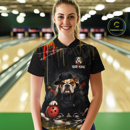 A woman wearing custom black bulldog bowling quarter-zip shirt front view featuring a fierce cartoon mascot, bowling ball and paint drip effect, displaying Your Name, at the bowling alley