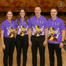 Load image into Gallery viewer, Four people wearing matching purple shirts with cartoon characters on a bowling alley.