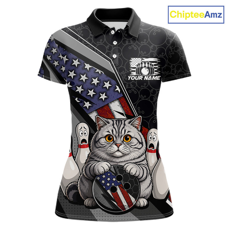Front view custom black patriotic cat bowling polo shirt featuring a cute cartoon feline, American flag, bowling ball and honeycomb pattern, displaying Your Name and Team Name