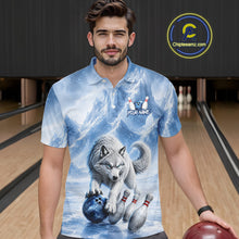 Load image into Gallery viewer, Man wearing a blue polo shirt with a wolf design in a bowling alley.