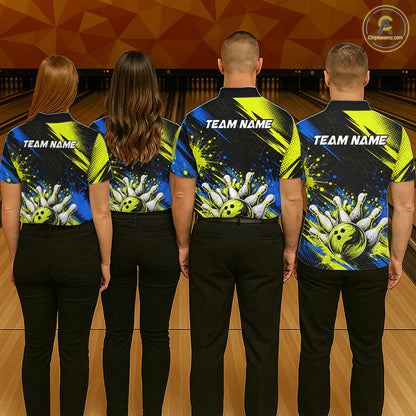 Four people standing in a bowling alley, viewed from behind, wearing matching custom bowling shirts with a black, blue, and neon yellow design featuring bowling balls and pins, and 'TEAM NAME' printed on the back.