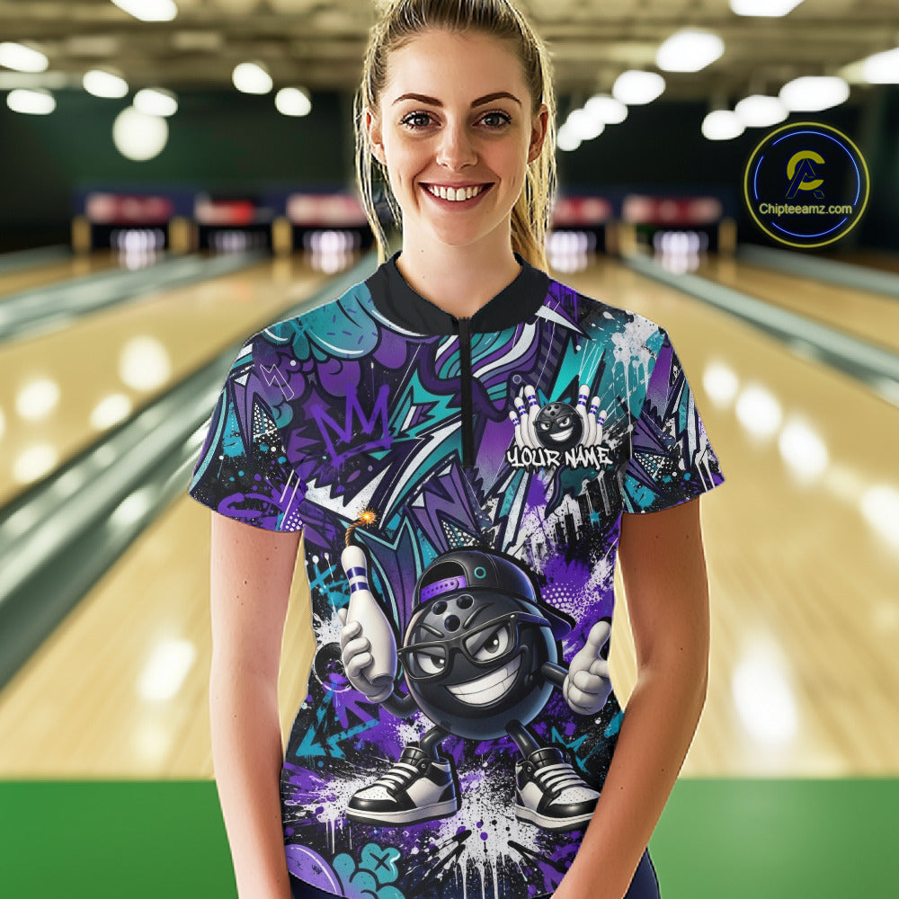 Person wearing a colorful bowling shirt with a graphic design in a bowling alley.