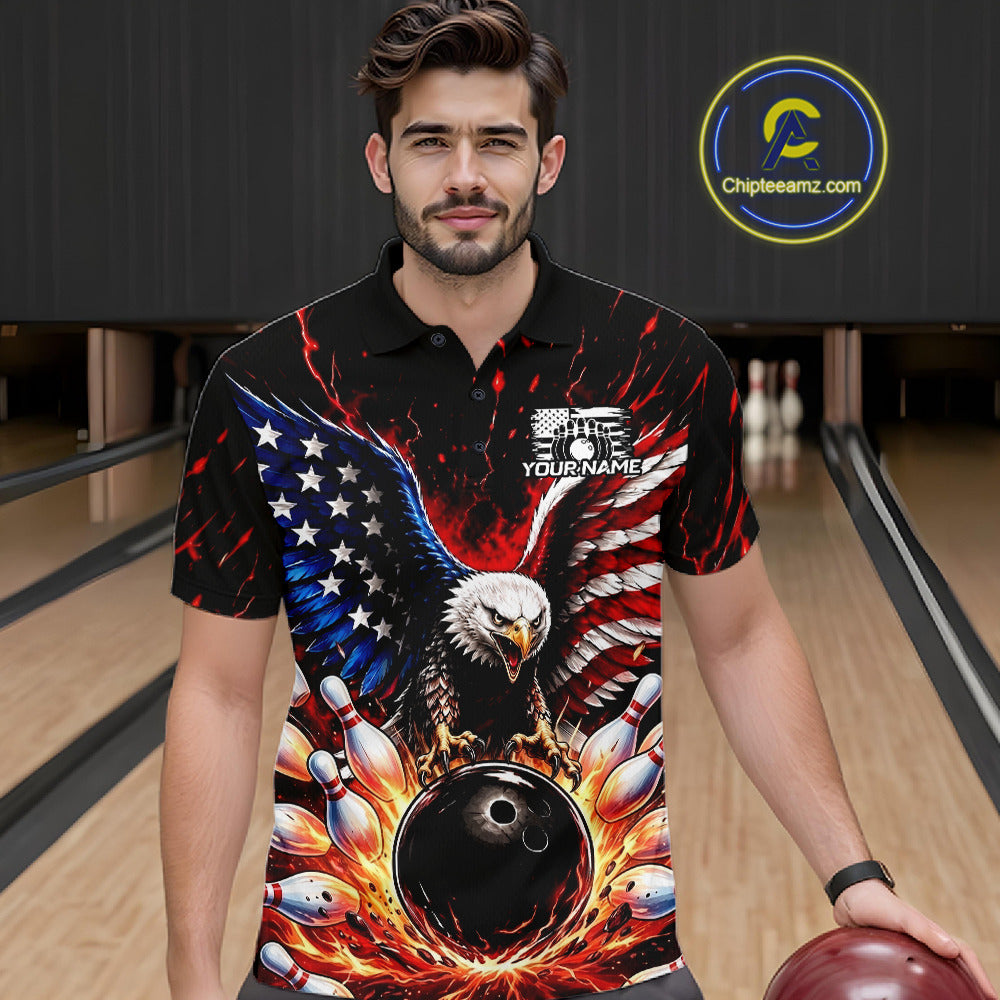 Man wearing a black polo shirt with an eagle and bowling design in a bowling alley.
