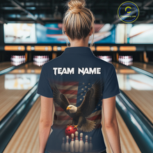 Load image into Gallery viewer, Woman wearing custom navy patriotic bowling polo shirt back view featuring a bald eagle and American flag, displaying Team Name, at the bowling alley