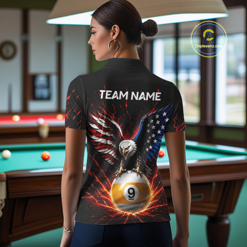 Person wearing a black shirt with an eagle and pool ball design in a room with a pool table.