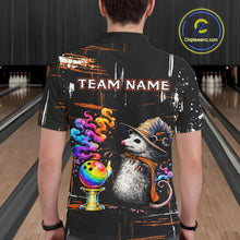 Load image into Gallery viewer, A person viewed from behind wearing a black short-sleeve bowling shirt with a large colorful graphic of a opossum wearing a wizard hat and scarf, a rainbow bowling ball, smoke, and the text 'TEAM NAME' across the back. The background shows bowling lanes.