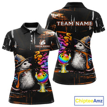 Load image into Gallery viewer, Custom short-sleeve polo shirt shown from the front and back on a white background. The shirt features a black base with a colorful graphic print of two opossums wearing witch hats, bowling balls, and swirling rainbow smoke, with customizable text placeholders 'TEAM NAME' and 'YOUR NAME'.