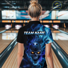 Load image into Gallery viewer, Woman wearing a black bowling polo shirt featuring a flaming skull with glowing orange eyes, blue smoke effects, and custom “TEAM NAME” text.