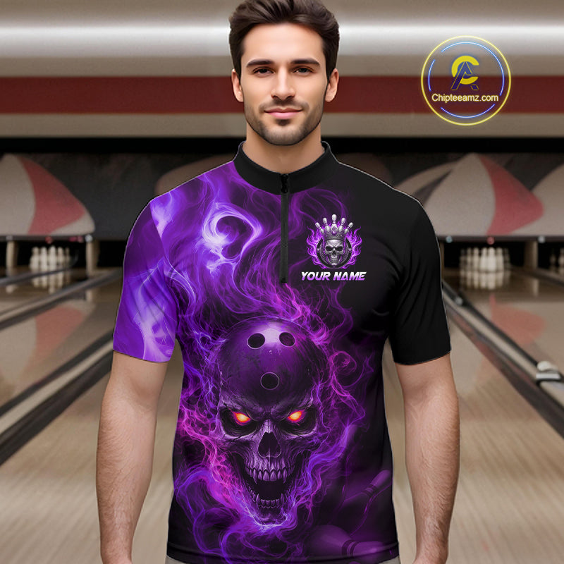Man wearing a black bowling quarter zip shirt featuring a flaming skull with glowing orange eyes, purple smoke effects, and custom “YOUR NAME” text.