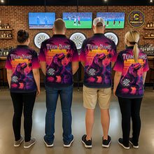 Load image into Gallery viewer, Four people wearing darts polo shirt featuring a dinosaur holding a dartboard with sunset and palm tree artwork on a colorful background