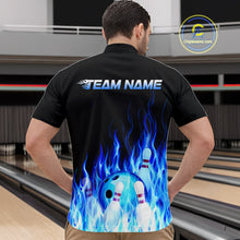 Load image into Gallery viewer, Man wearing a black bowling shirt with blue flames and a bowling ball design, standing on a bowling lane.